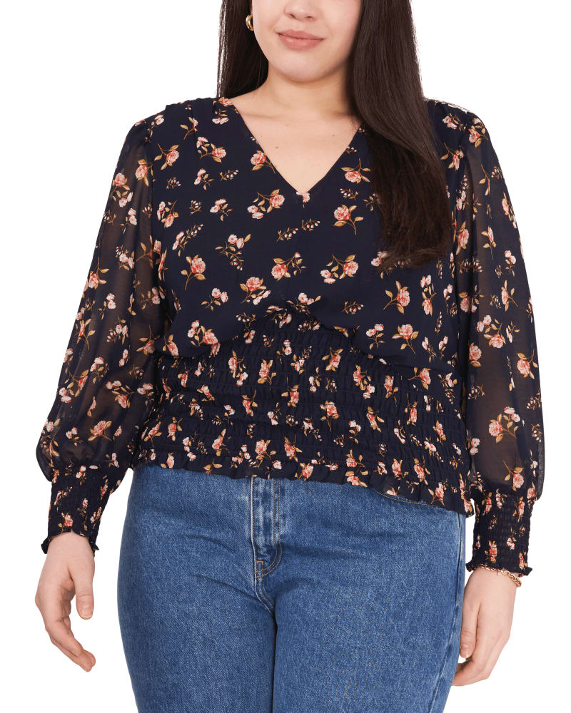 Front of a model wearing a size 0X Hadlee Smocked Top in FLRL TWLGHT BLU by 1.State. | dia_product_style_image_id:262222